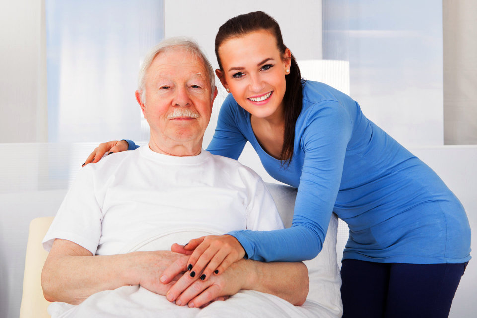 a female nurse with an elderly man