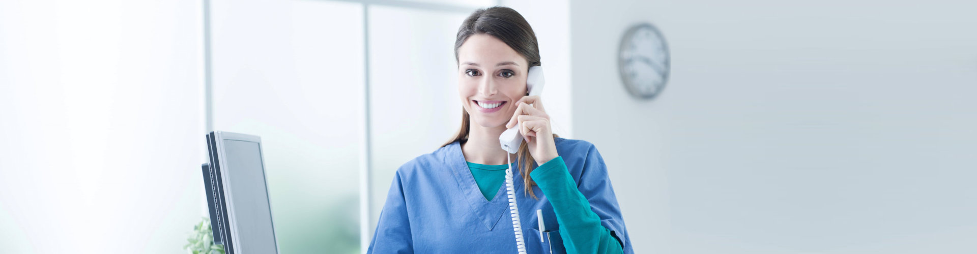 a female nurse on a telephone